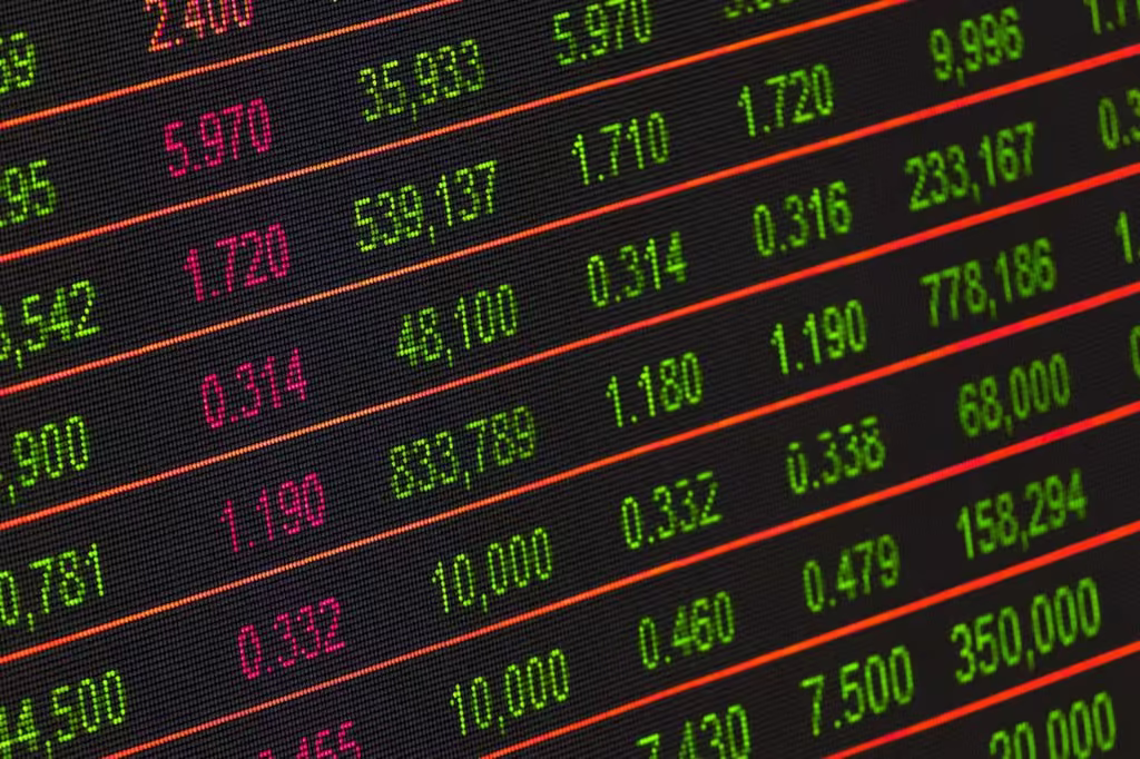 Stock exchange board with red and green market figures