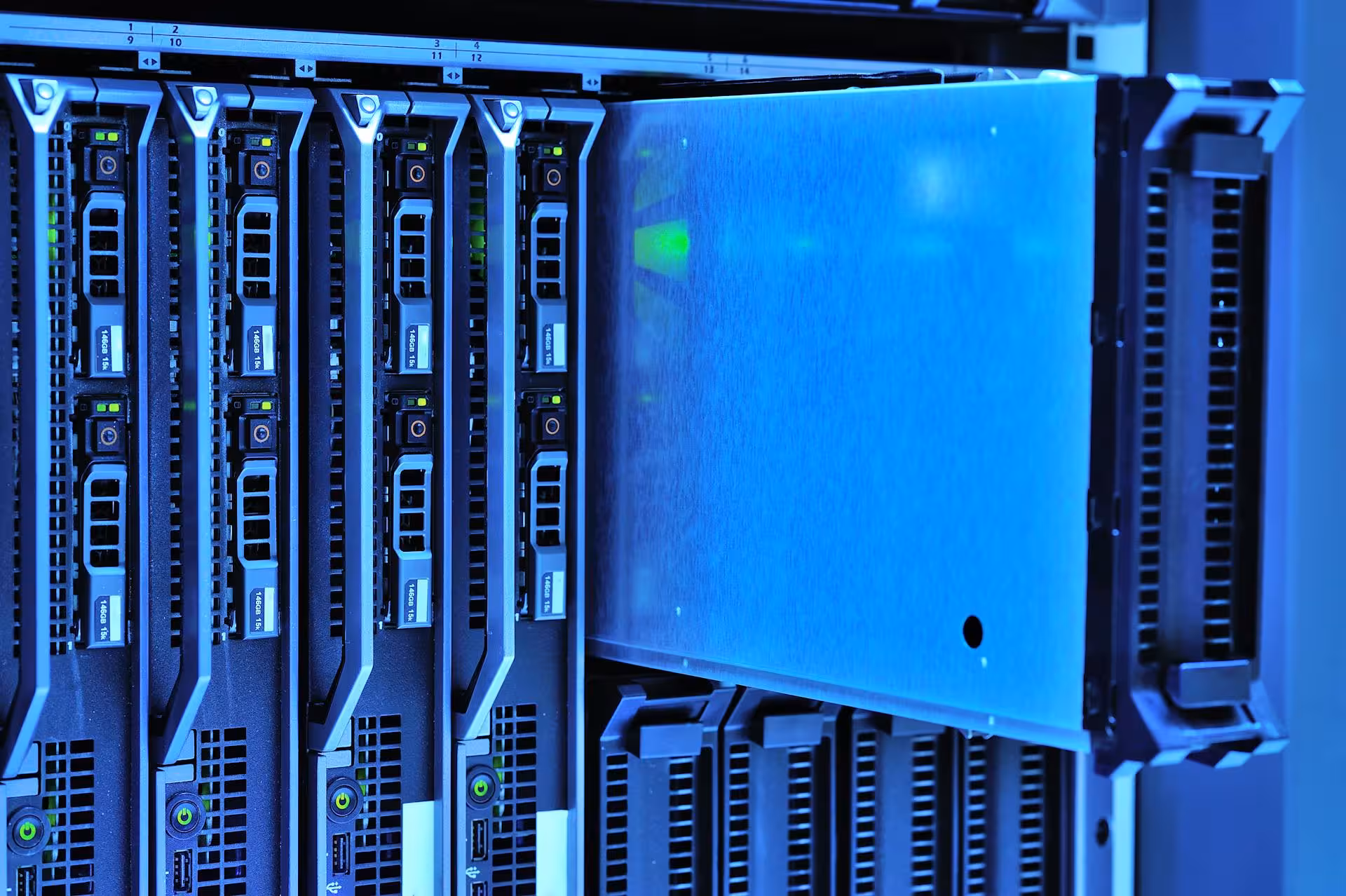 Blue-lit server hardware in a data center rack